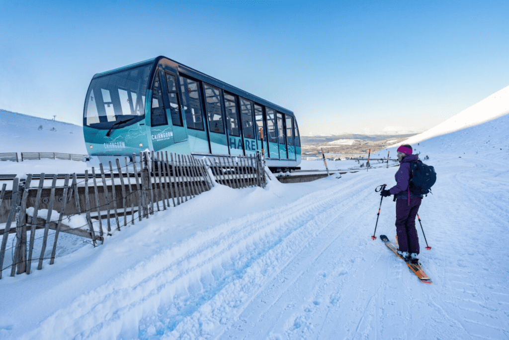 Cairngorm Mountain with Skier and Railway. Photo by https://www.cairngormmountain.co.uk/the-ski-area/