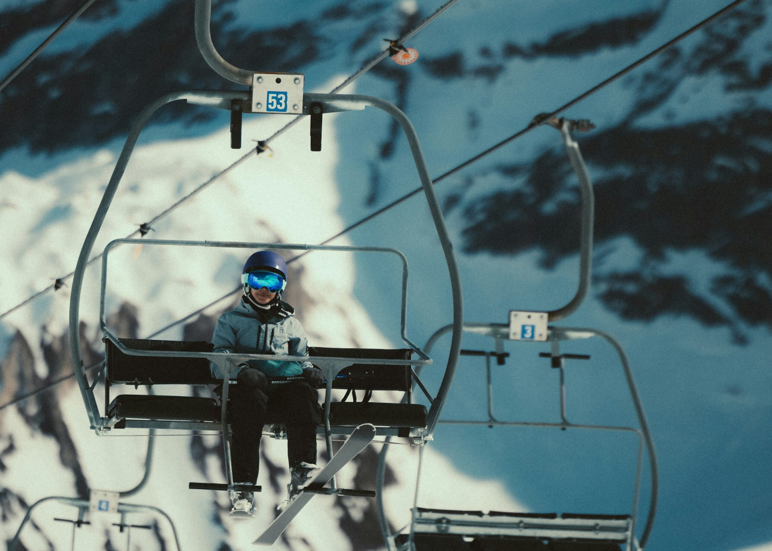 Someone on a ski lift. Photo by Michael McKay on Unsplash