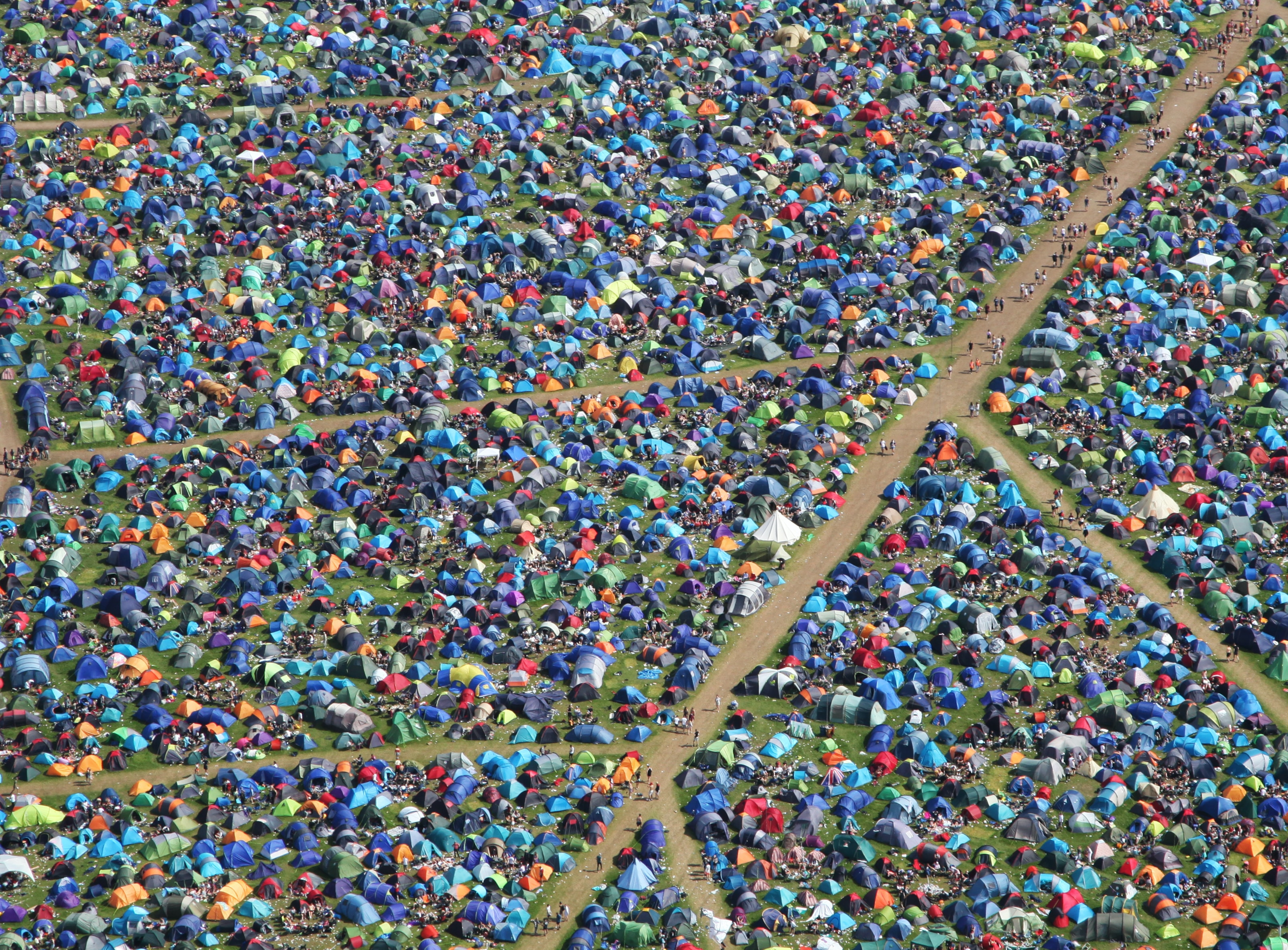 A field full of tents at a festival. Photo by Johnny Such on Unsplash