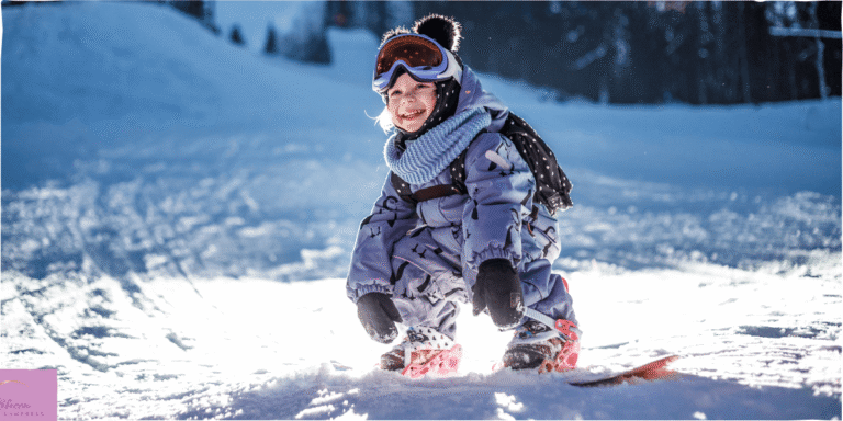 A young girl on her snowboard. Source: Canva