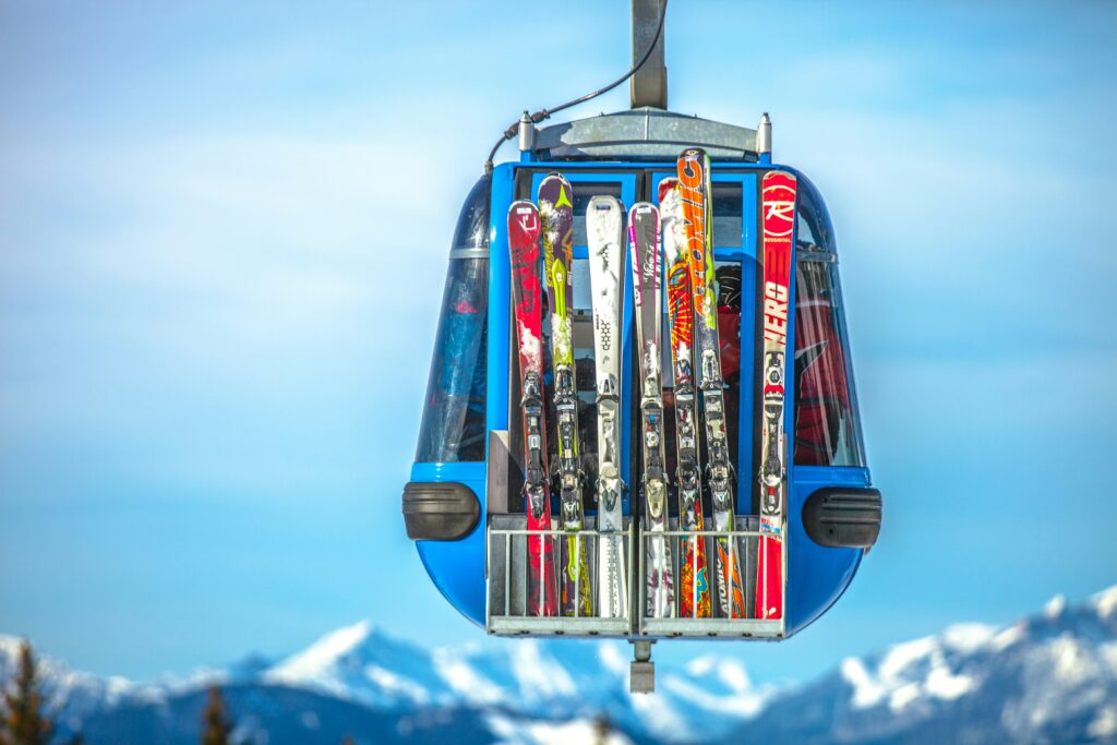 Skis on a Gondola. Photo by Kipras Štreimikis on Unsplash