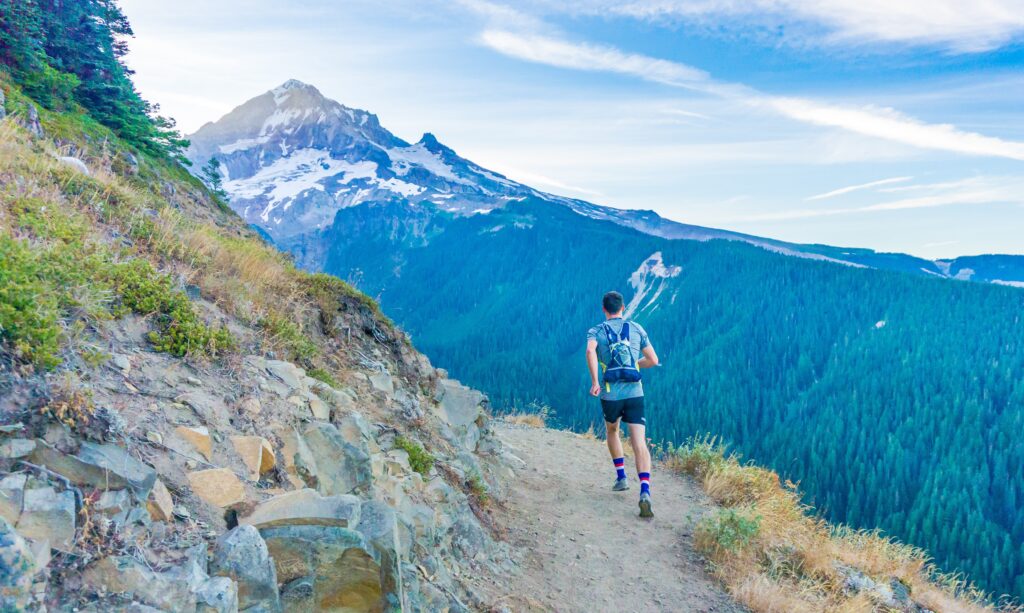 A person running in the mountains. Photo by Brian Erickson on Unsplash