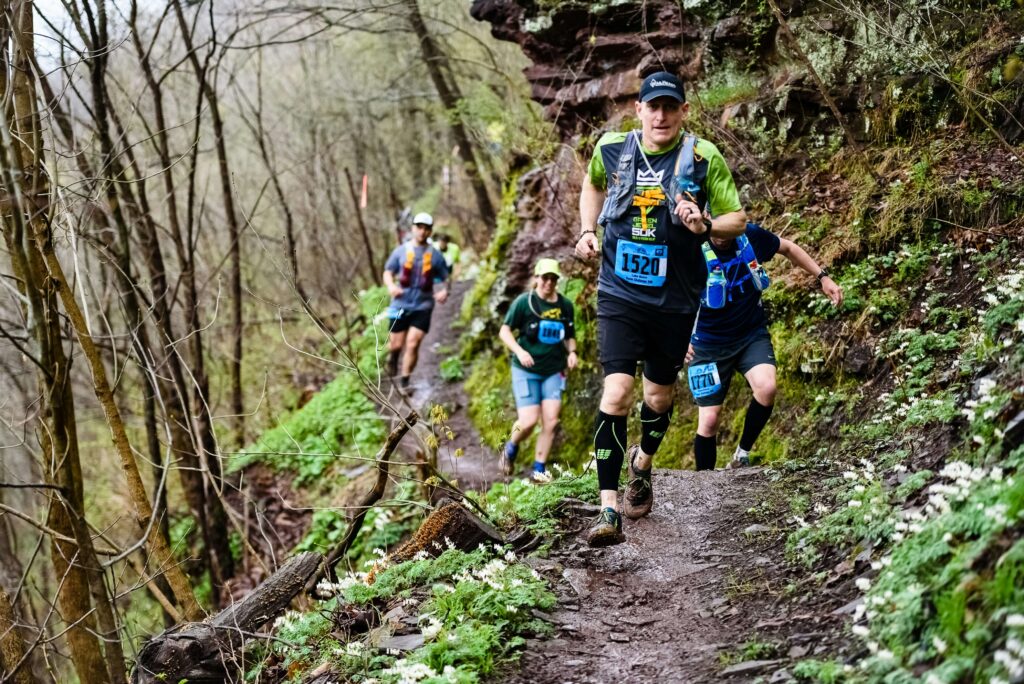 A trail running race. Find your trail running community. Photo by Luke Baum on Unsplash