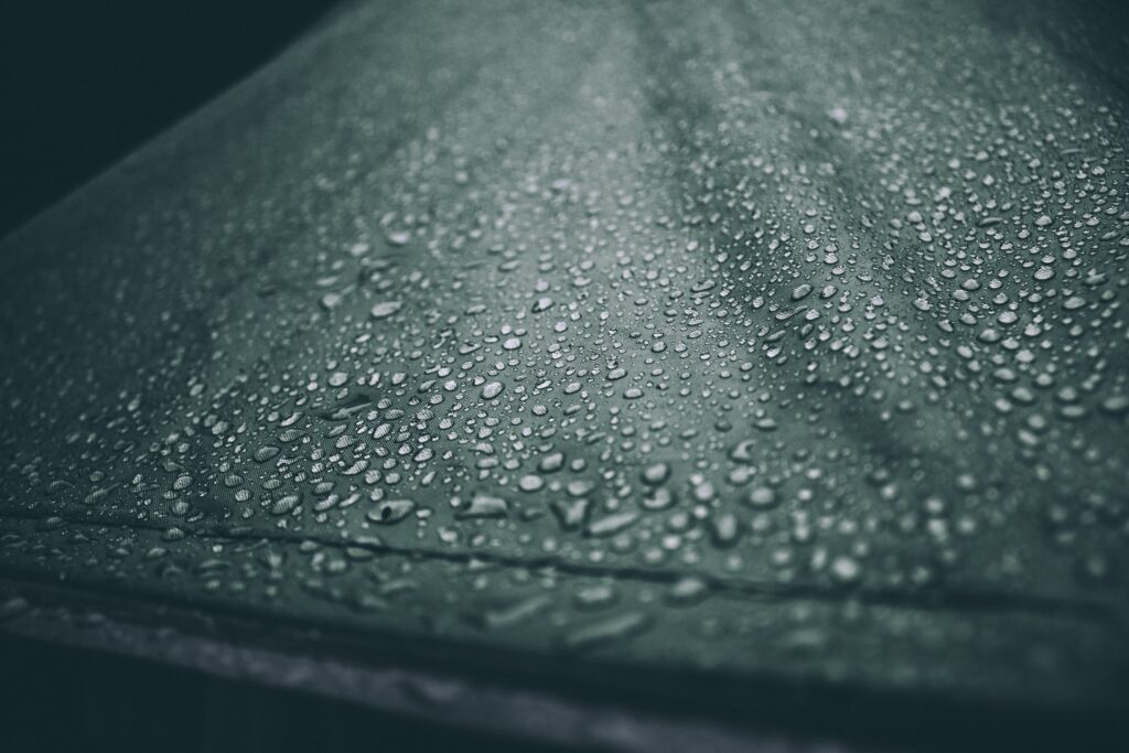 Water beads on a tent. How to Waterproof a Tent. Photo by frame harirak on Unsplash