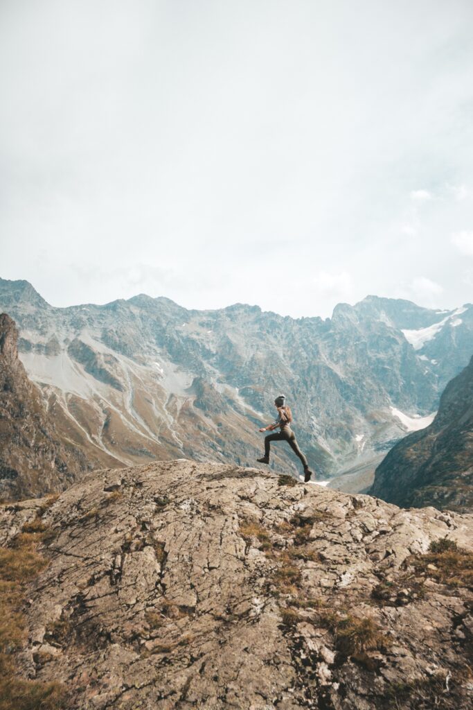 Someone running in the mountains. Photo by Laurine Bailly on Unsplash