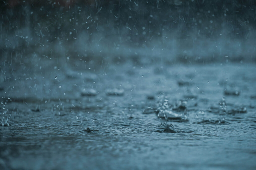 Rain droplets on the ground. Photo by Abhishek Tewari on Unsplash