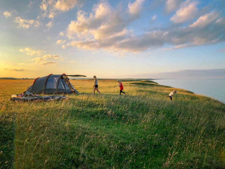 A family camping. Photo by Mattias Helge on Unsplash