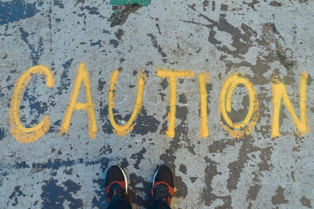 A caution sign. Photo by Goh Rhy Yan on Unsplash