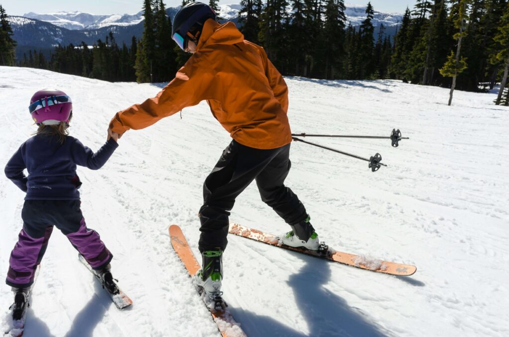 A young girl learning to ski. Photo by Greg Rosenke on Unsplash