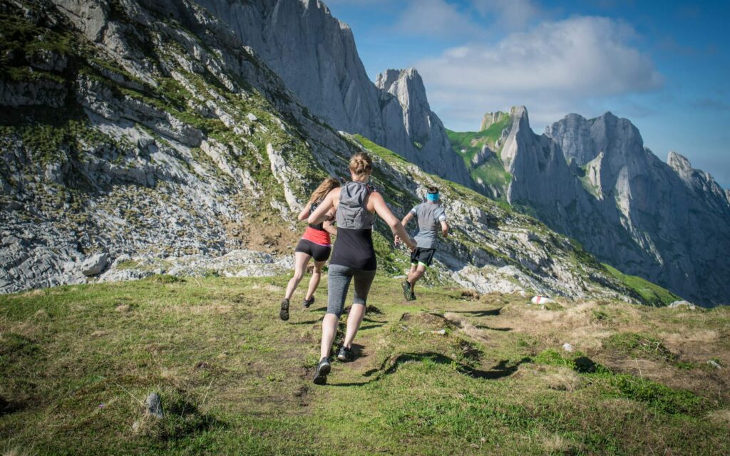 Trail runners on a mountain. Trail running for beginners. Photo by Lucas Canino on Unsplash