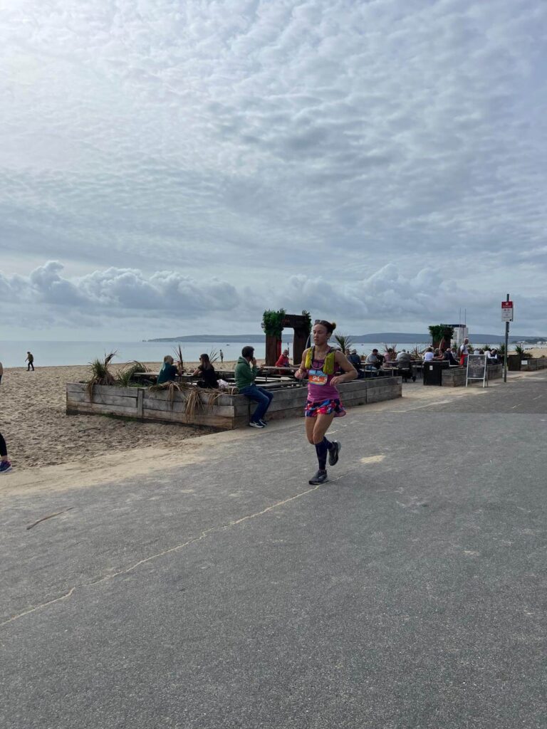 Rebecca running along the beach, past Rockwater, heading toward Bournemouth Pier. Source: Rebecca Campbell Ltd